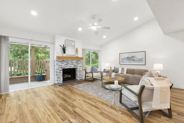 a living room with furniture and a fireplace