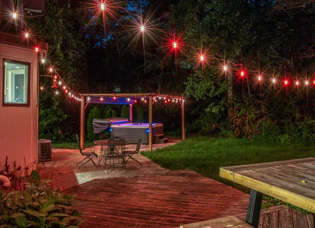 a view of a chairs and table in patio with a fire pit
