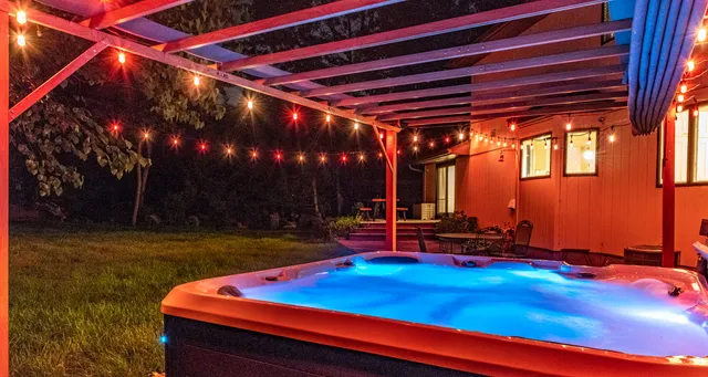 a backyard of a house with outdoor seating