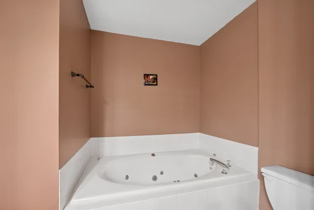 a white bath tub sitting in a bathroom
