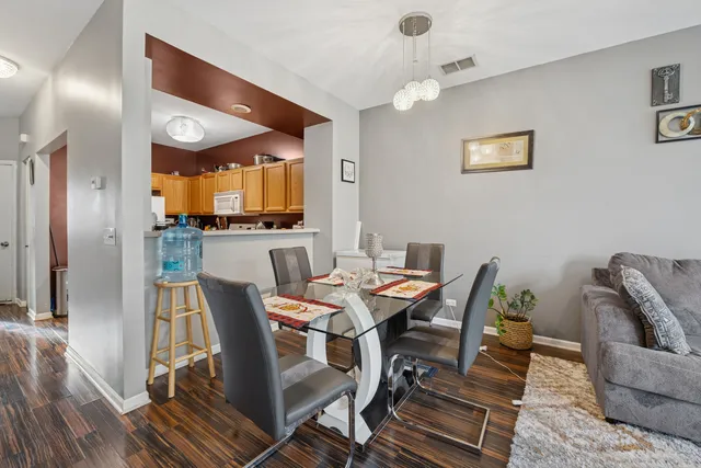 a view of a dining room with furniture and wooden floor