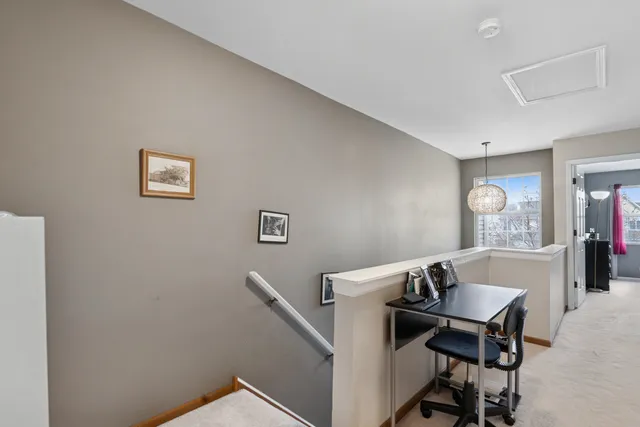 a view of a workspace with furniture