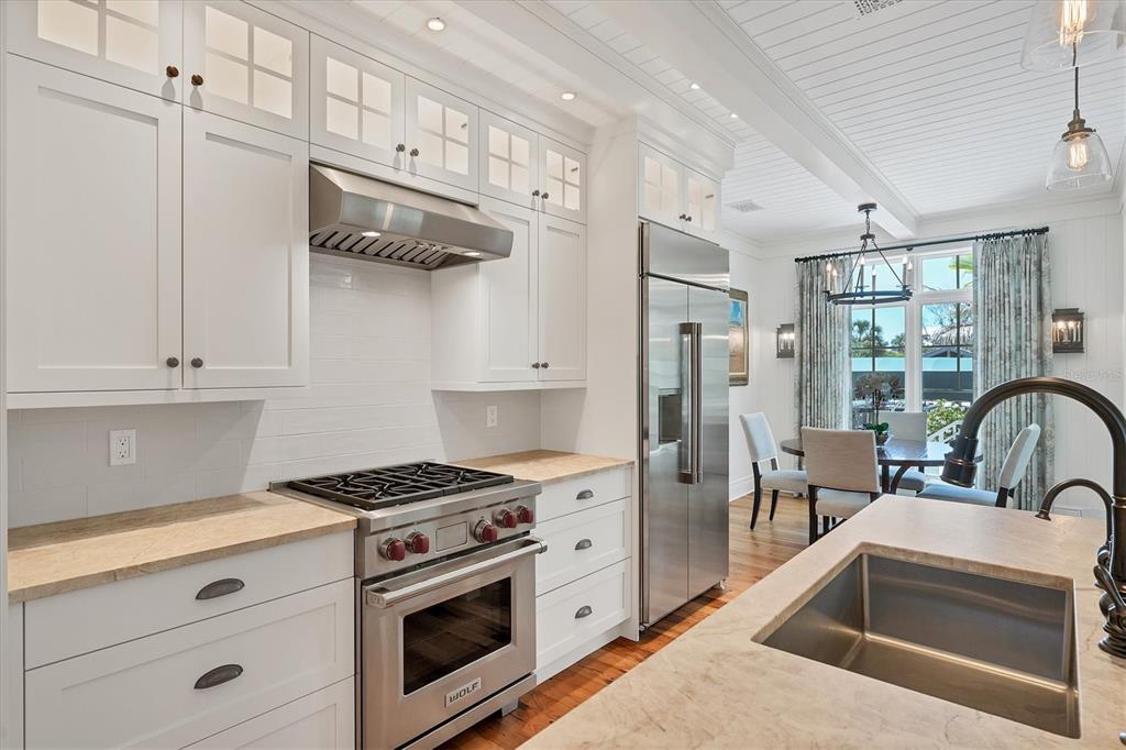 150 1st Street East Boca Grande, FL 33921 - Photo 13 of 72 a kitchen with stainless steel appliances granite countertop a sink stove and refrigerator