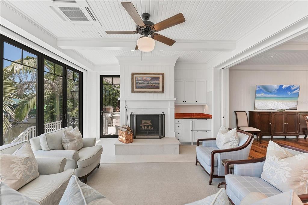 150 1st Street East Boca Grande, FL 33921 - Photo 21 of 72 a living room with furniture and a fireplace