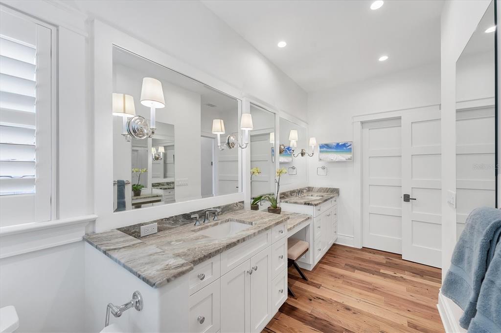 150 1st Street East Boca Grande, FL 33921 - Photo 29 of 72 a bathroom with a granite countertop sink and a mirror