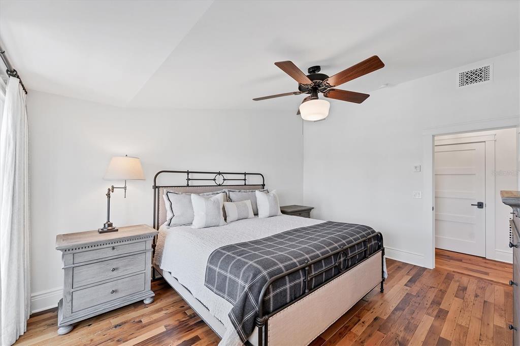 150 1st Street East Boca Grande, FL 33921 - Photo 35 of 72 a bedroom with a bed and a ceiling fan