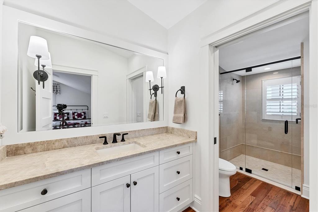 150 1st Street East Boca Grande, FL 33921 - Photo 45 of 72 a bathroom with a sink double vanity granite tub and shower