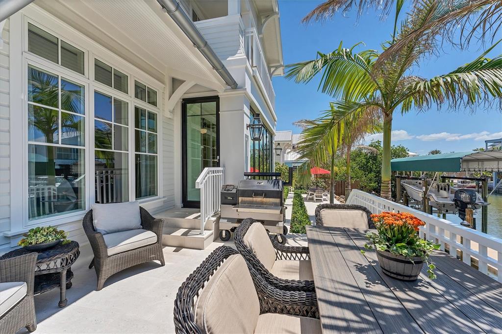 150 1st Street East Boca Grande, FL 33921 - Photo 47 of 72 a view of a patio with couches and potted plants