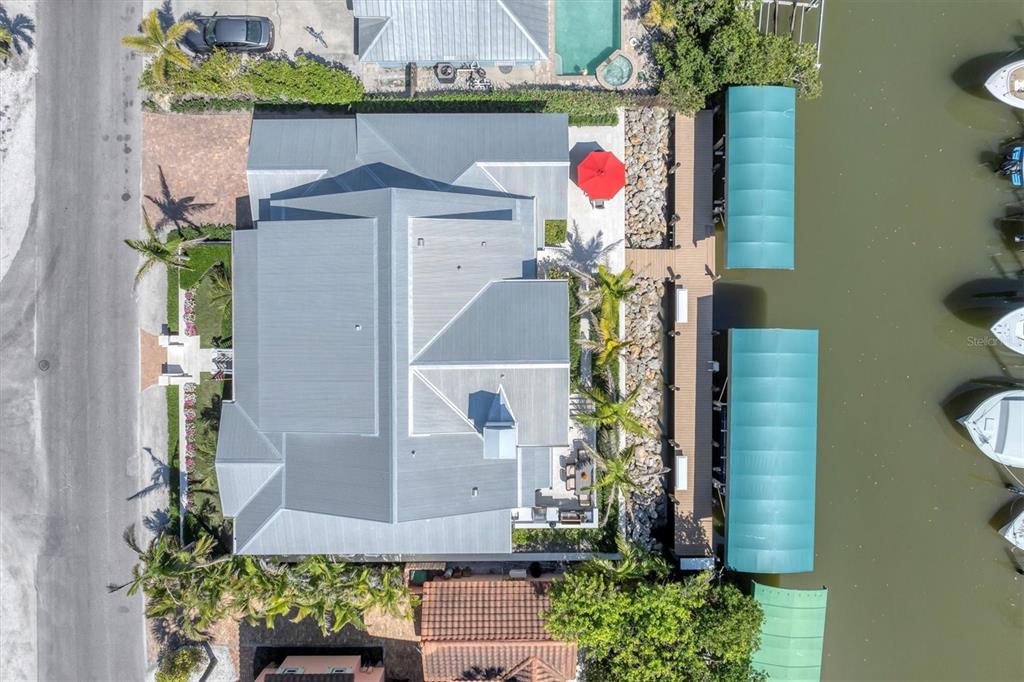 150 1st Street East Boca Grande, FL 33921 - Photo 54 of 72 a front view of a house with a garden
