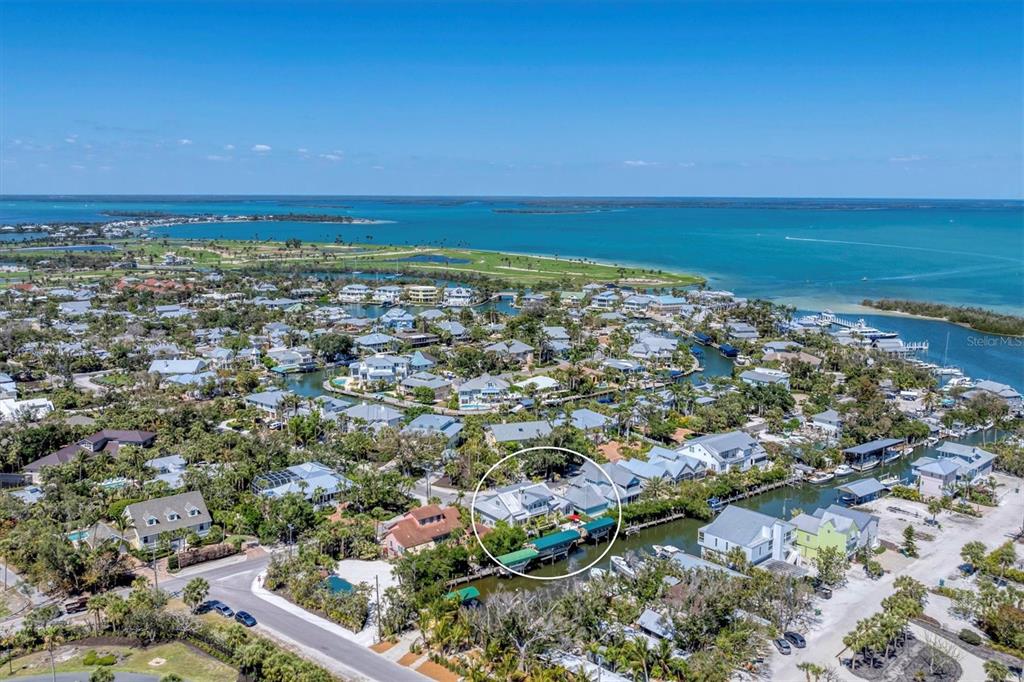 150 1st Street East Boca Grande, FL 33921 - Photo 59 of 72 an aerial view of residential building and ocean