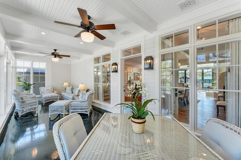 150 1st Street East Boca Grande, FL 33921 - Photo 6 of 72 a living room with furniture a chandelier and a potted plant