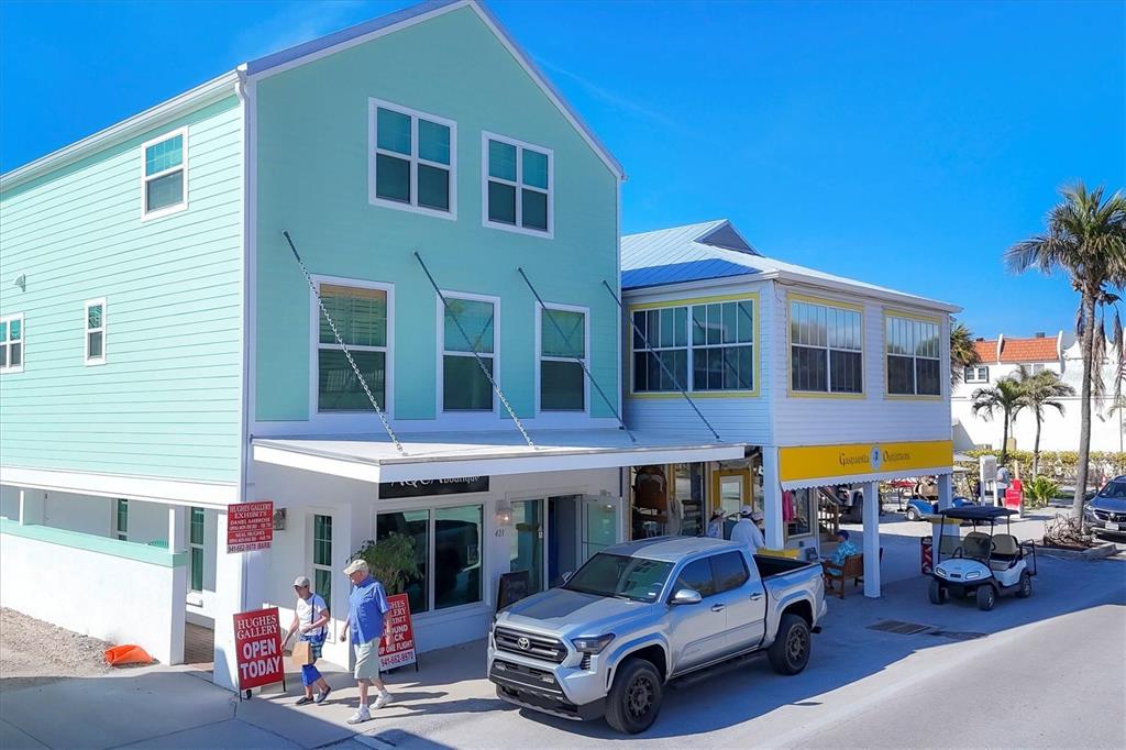 150 1st Street East Boca Grande, FL 33921 - Photo 64 of 72 a car parked in front of a building