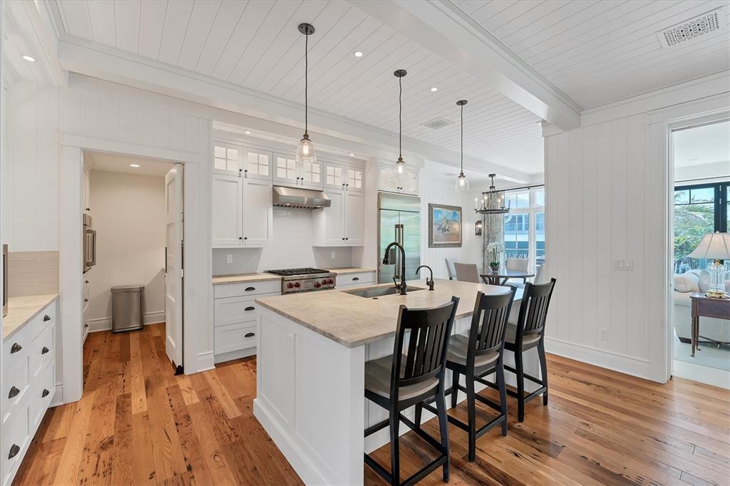 150 1st Street East Boca Grande, FL 33921 - Photo 9 of 72 a large kitchen with a table and chairs