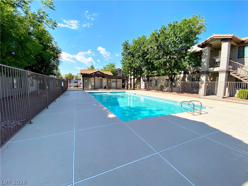1575 West Warm Springs Road, Unit 1024 Henderson, NV 89014 - Photo 15 of 25 A sparkling pool and surrounding deck create a refreshing outdoor oasis.