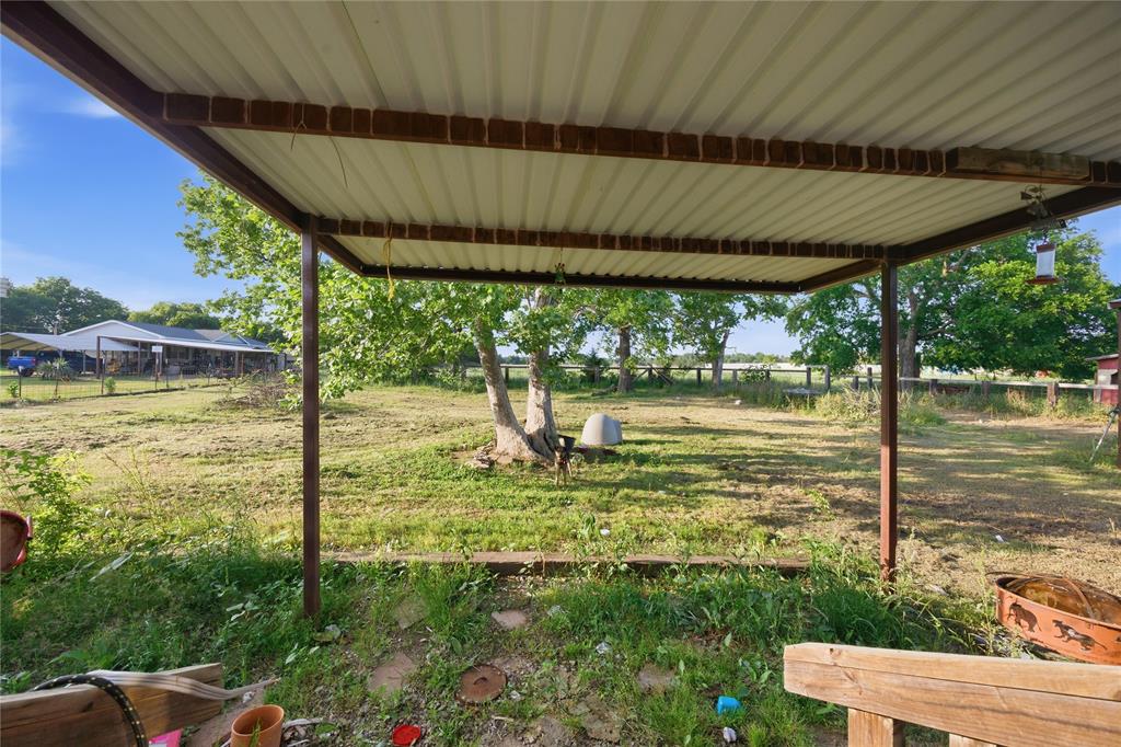 2449 East Fm 120 Denison, TX 75021 - Photo 8 of 30 a view of a swimming pool with a garden