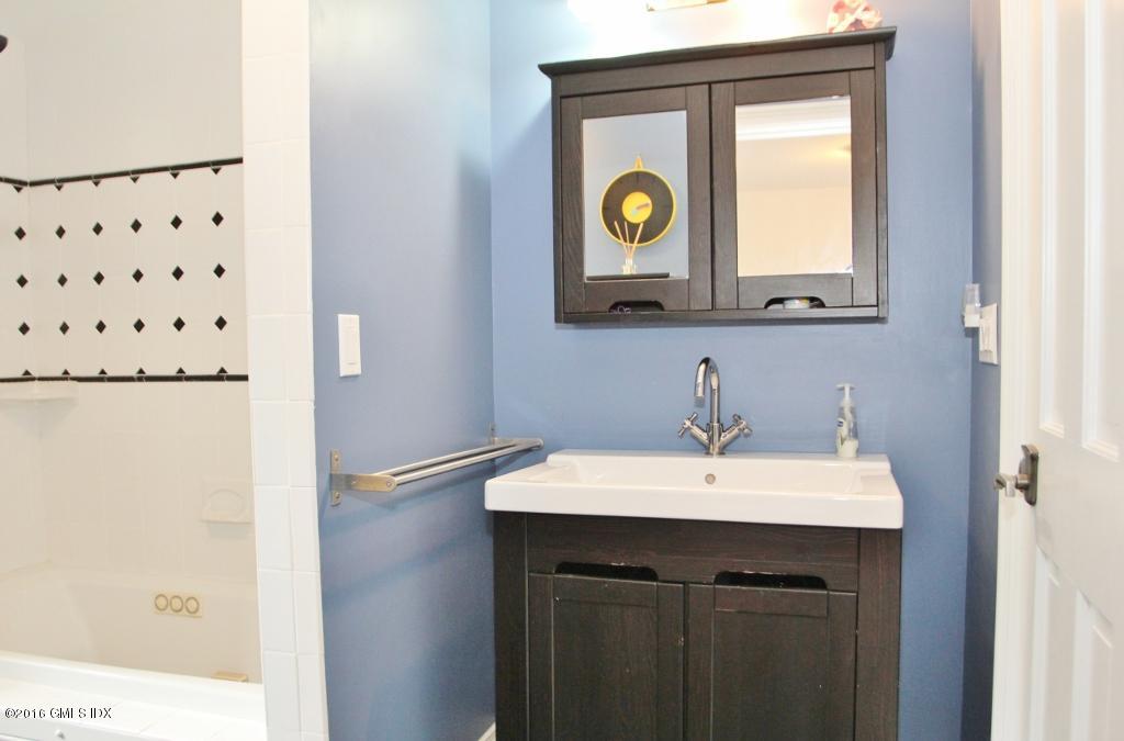 31 Bonwit Road Riverside, CT 06878 - Photo 13 of 31 a bathroom with a sink and a mirror