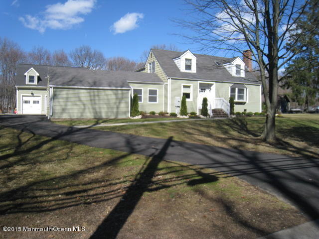 67 Aberdeen Road Matawan, NJ 07747 - Photo 1 of 17 a view of a big house with a big yard and large tree