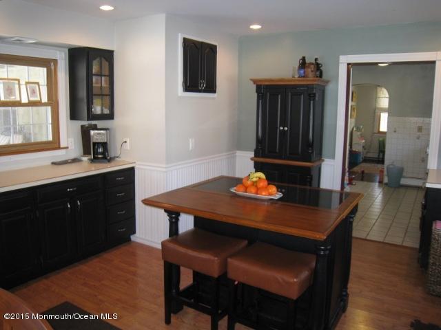 67 Aberdeen Road Matawan, NJ 07747 - Photo 4 of 17 a kitchen with a table and chairs in it