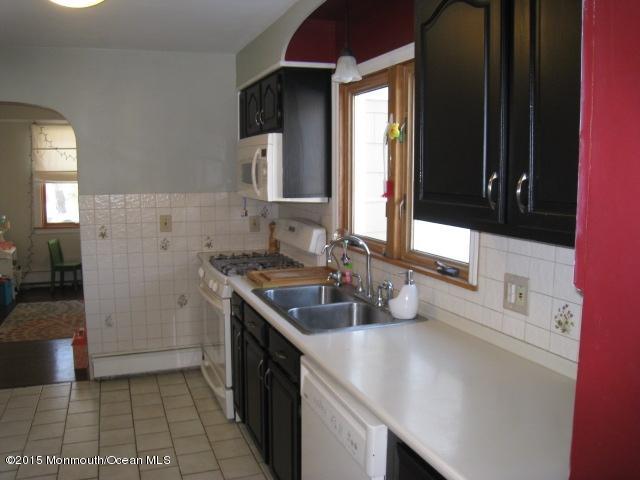 67 Aberdeen Road Matawan, NJ 07747 - Photo 6 of 17 a kitchen with a sink stove and cabinets