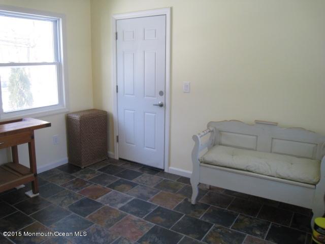67 Aberdeen Road Matawan, NJ 07747 - Photo 7 of 17 a living room with a couch and a window