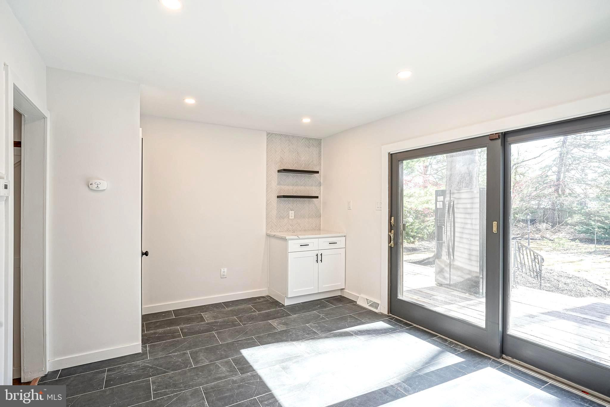 511 Boundary Road Pitman, NJ 08071 - Photo 14 of 36 a view of a kitchen with a sink and dishwasher with wooden floor