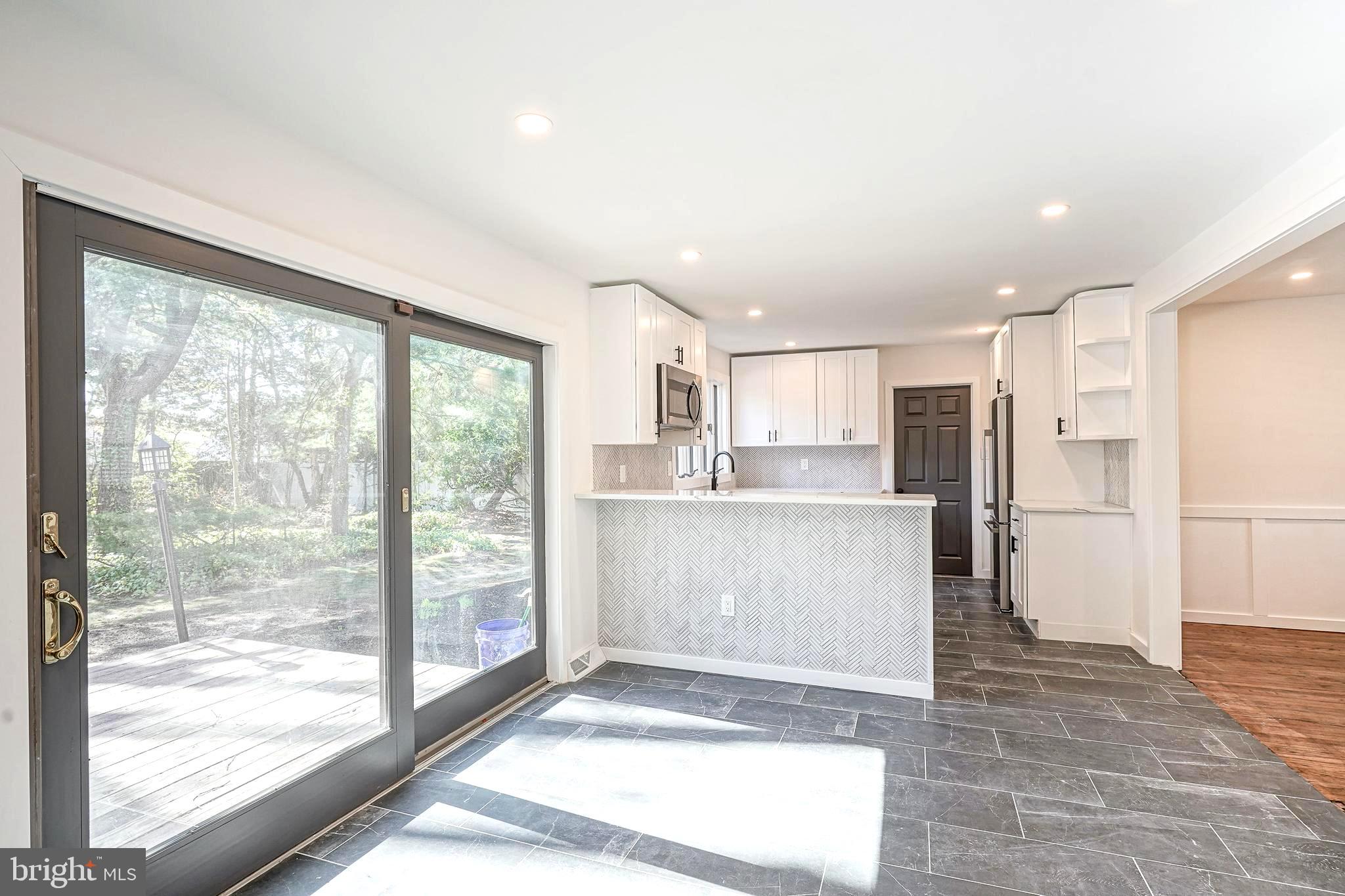 511 Boundary Road Pitman, NJ 08071 - Photo 15 of 36 a view of a kitchen with refrigerator and wooden floor