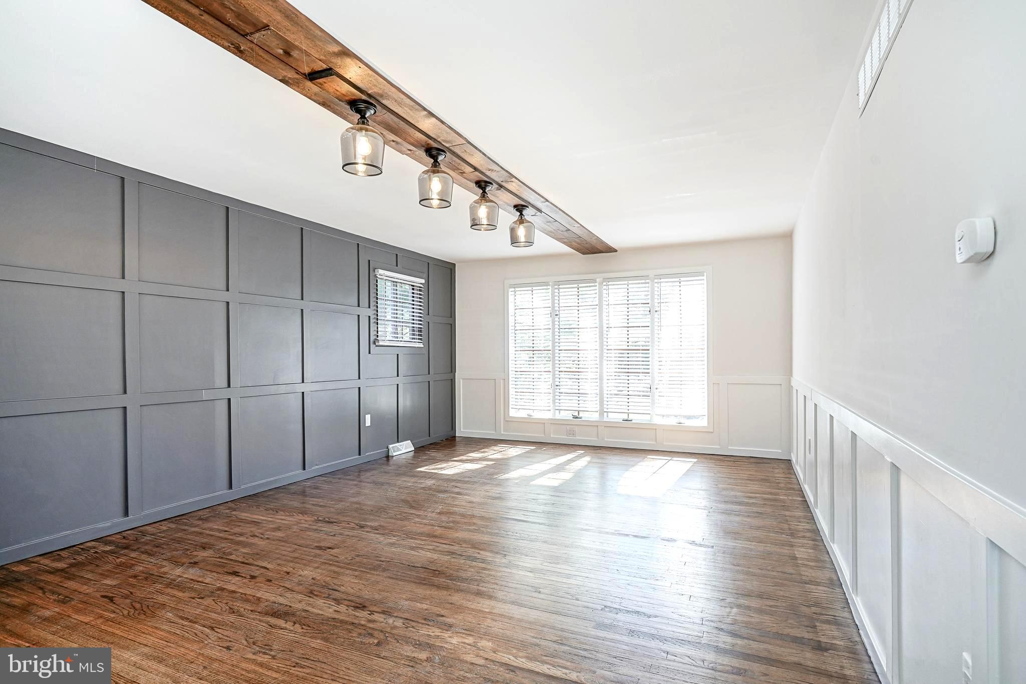 511 Boundary Road Pitman, NJ 08071 - Photo 17 of 36 a view of an empty room with wooden floor and a window