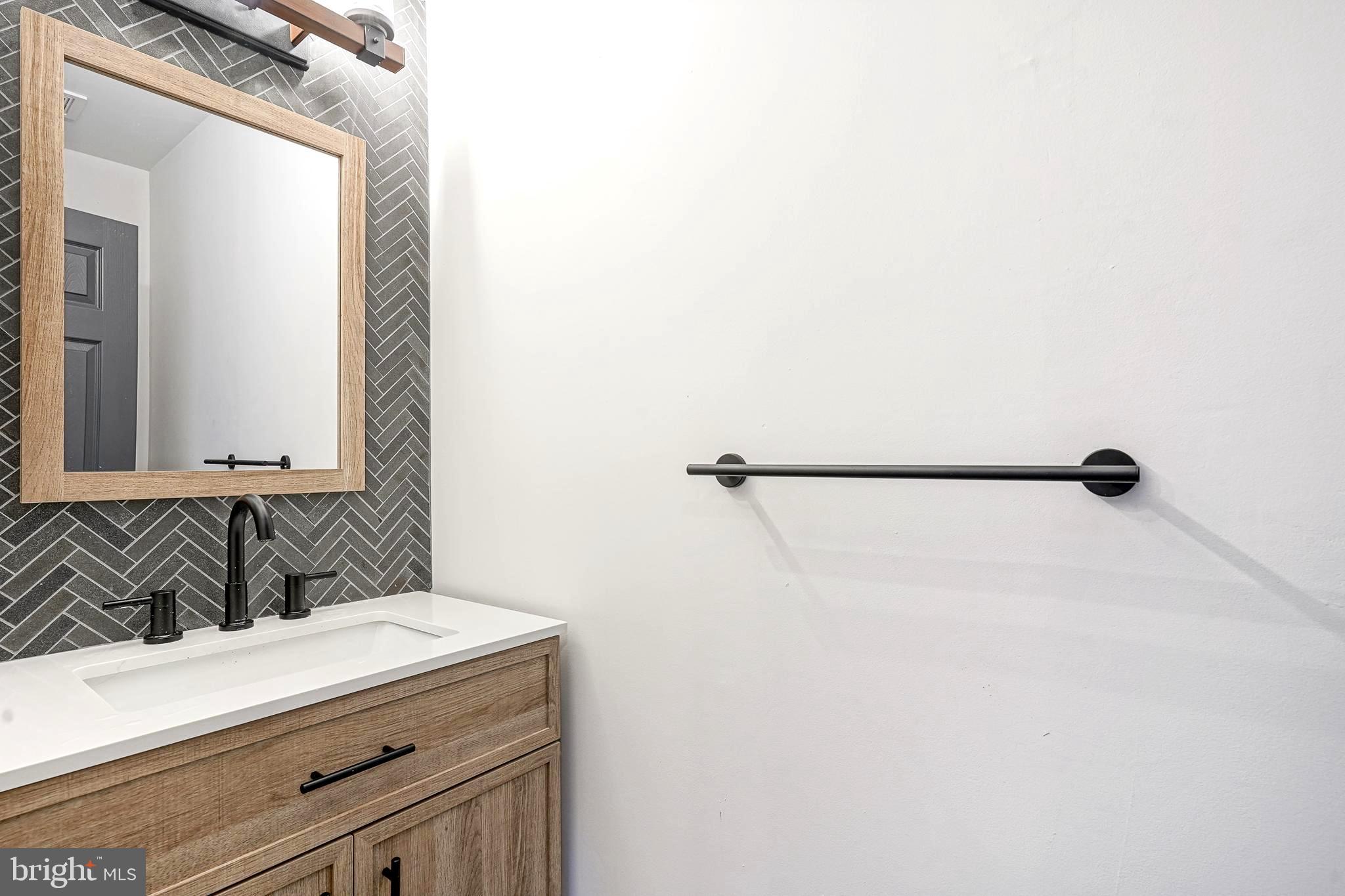 511 Boundary Road Pitman, NJ 08071 - Photo 19 of 36 a bathroom with a sink and a mirror