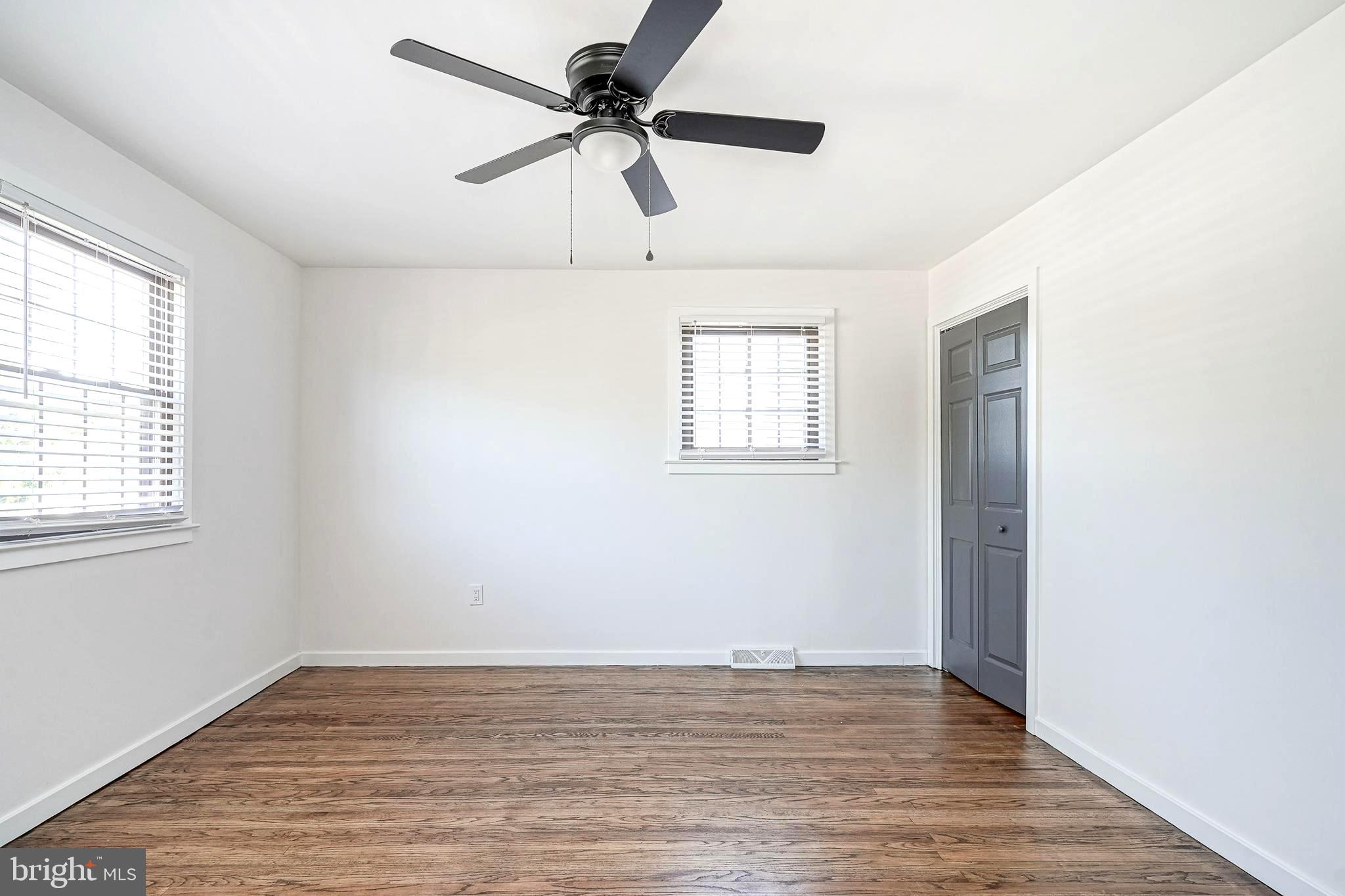 511 Boundary Road Pitman, NJ 08071 - Photo 29 of 36 wooden floor in an empty room with a window
