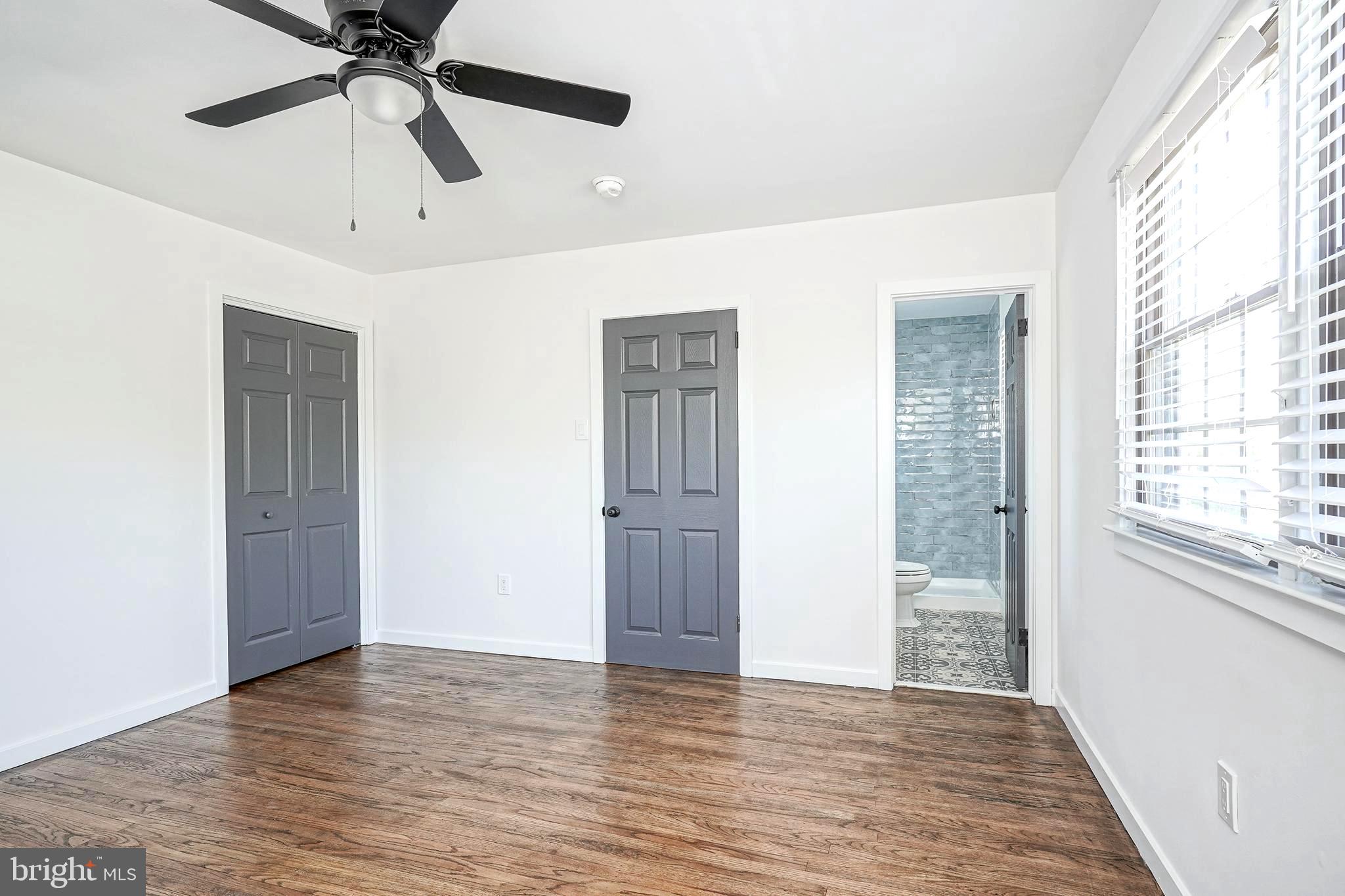 511 Boundary Road Pitman, NJ 08071 - Photo 30 of 36 a view of an empty room with a window and wooden floor