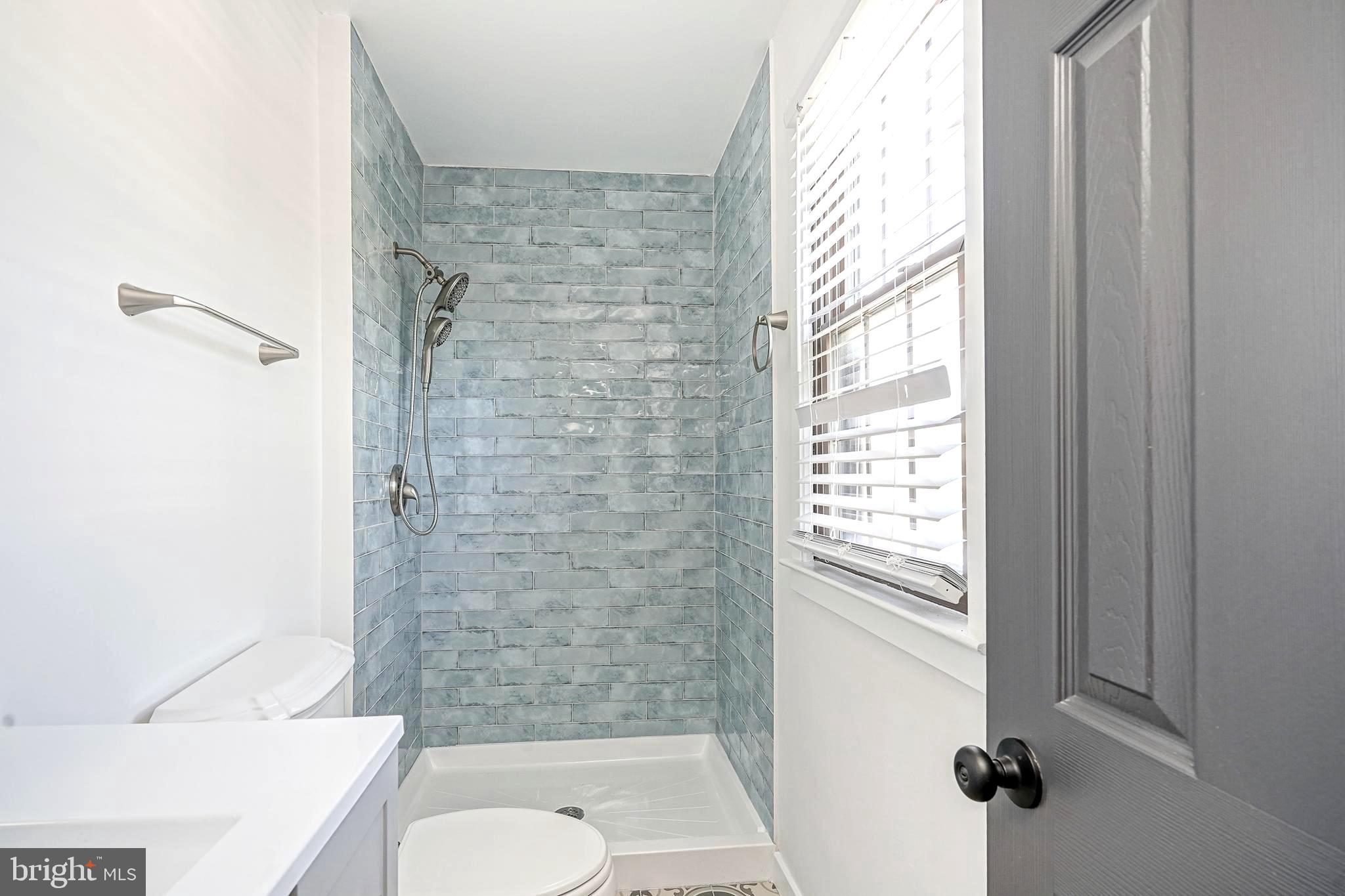 511 Boundary Road Pitman, NJ 08071 - Photo 32 of 36 a bathroom with a toilet and a shower
