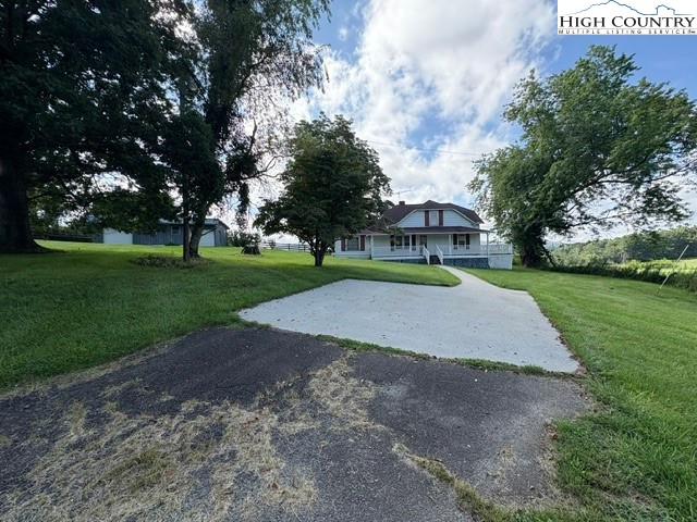 a view of a park with large trees