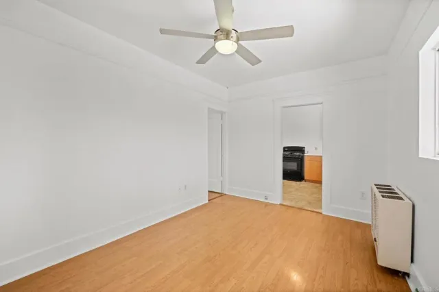 a view of an empty room with wooden walls