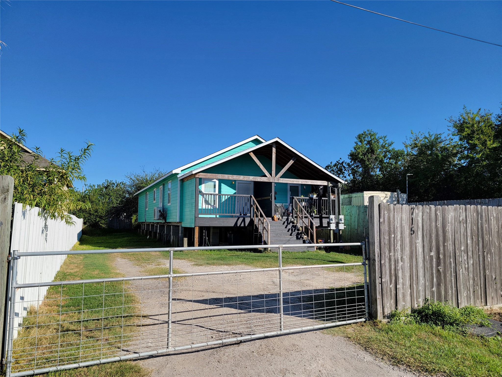 715 11th Street, Unit A Dickinson, TX 77539 - Photo 14 of 14 Manual gate for privacy/security. Property fully fenced.