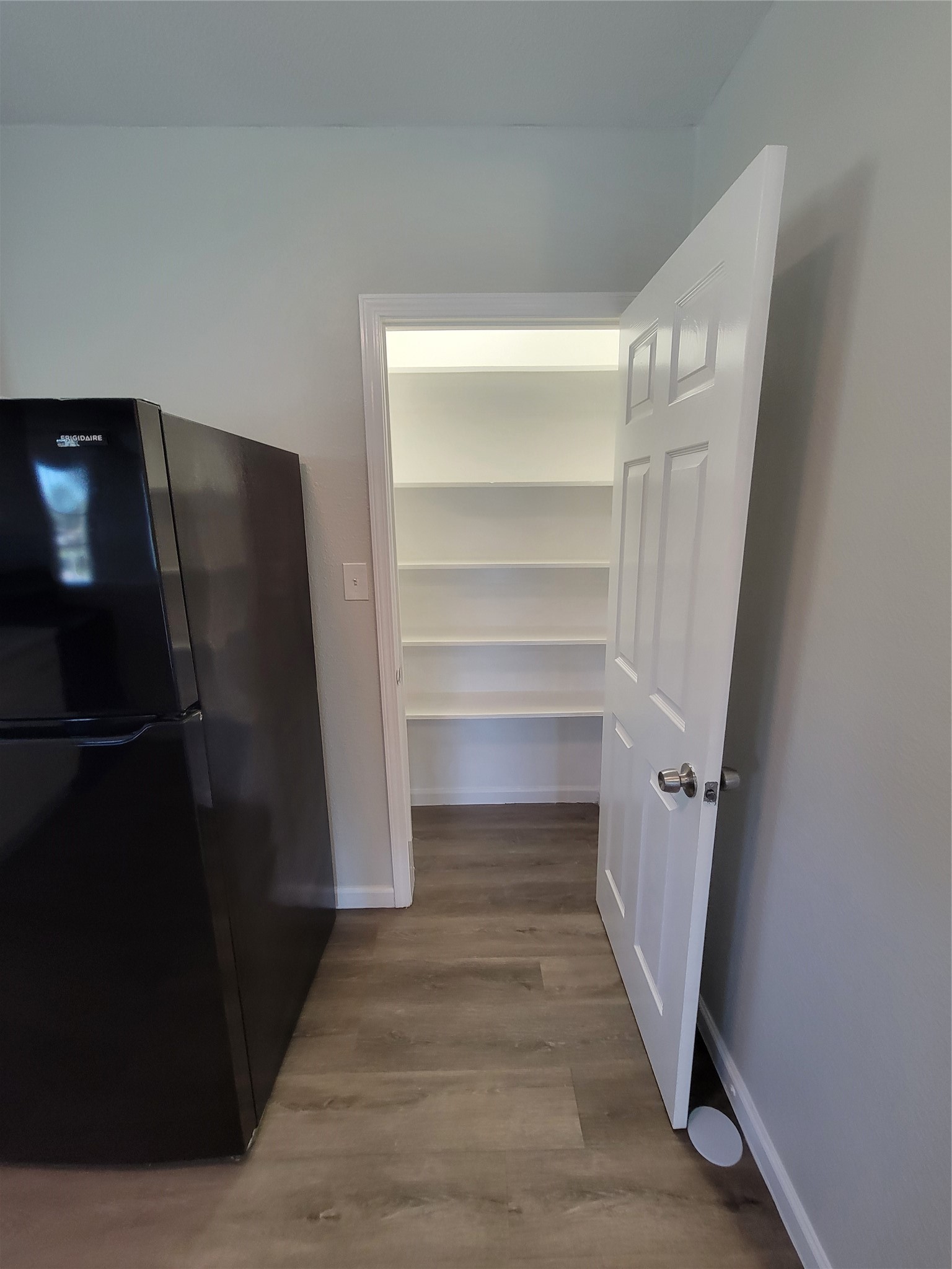 715 11th Street, Unit A Dickinson, TX 77539 - Photo 4 of 14 Lighted pantry provides extra storage space.