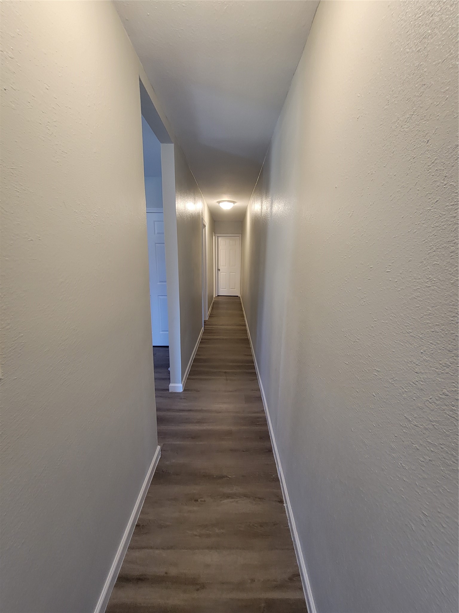 715 11th Street, Unit A Dickinson, TX 77539 - Photo 5 of 14 Hallway to two bedrooms and 1 bath.