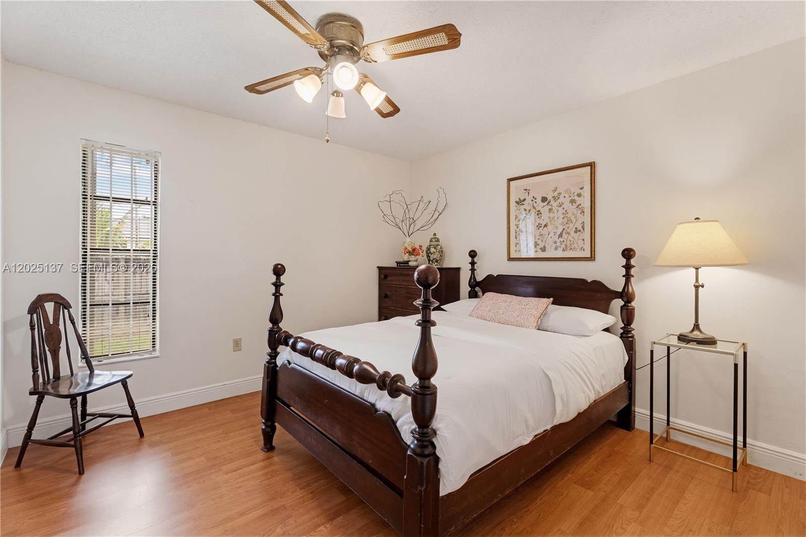 11480 Southwest 96th Terrace Miami, FL 33176 - Photo 17 of 54 a bedroom with bed and a chair