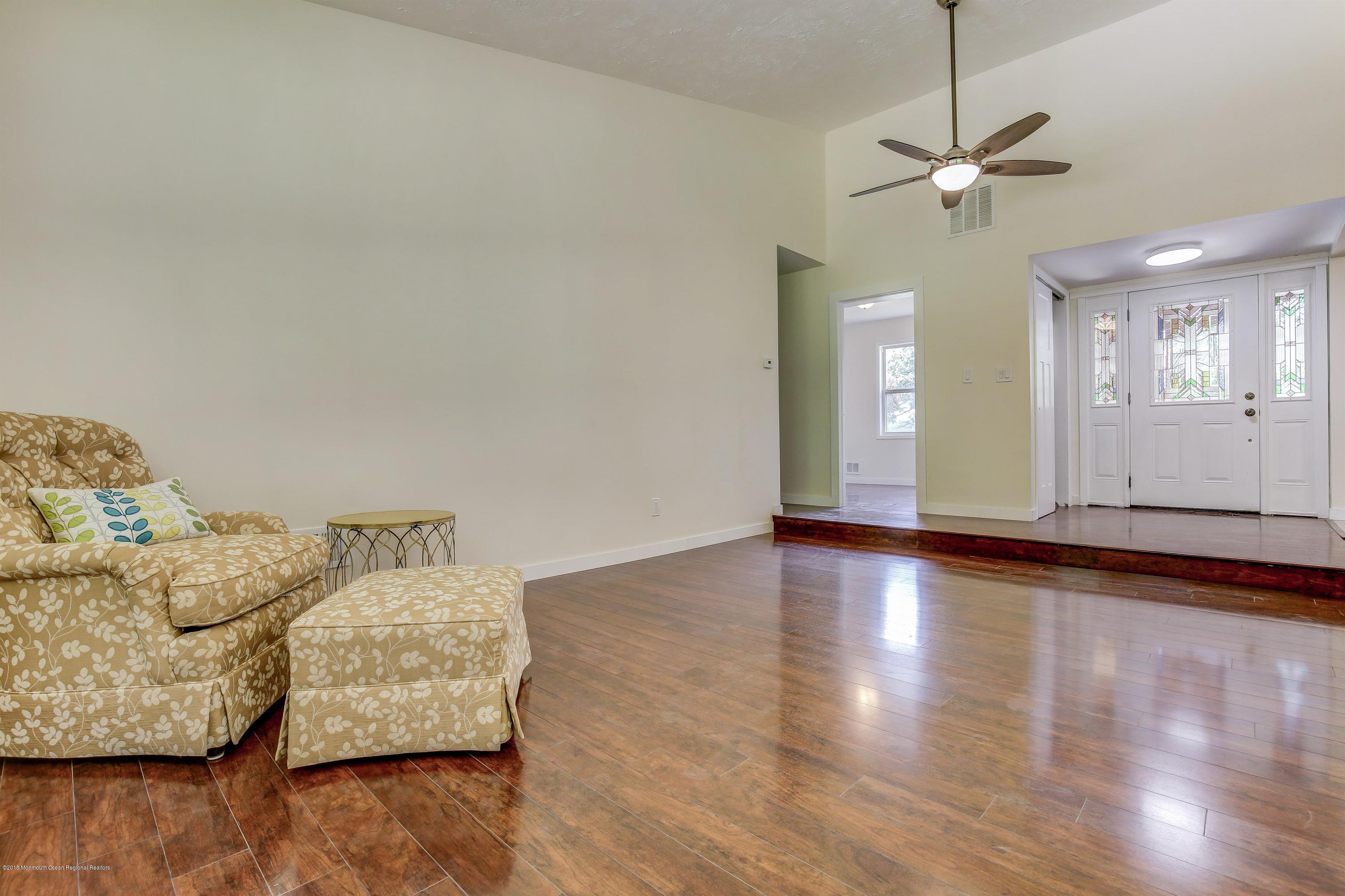 38 Dutch Valley Road Howell, NJ 07731 - Photo 11 of 20 a living room with furniture and a wooden floor