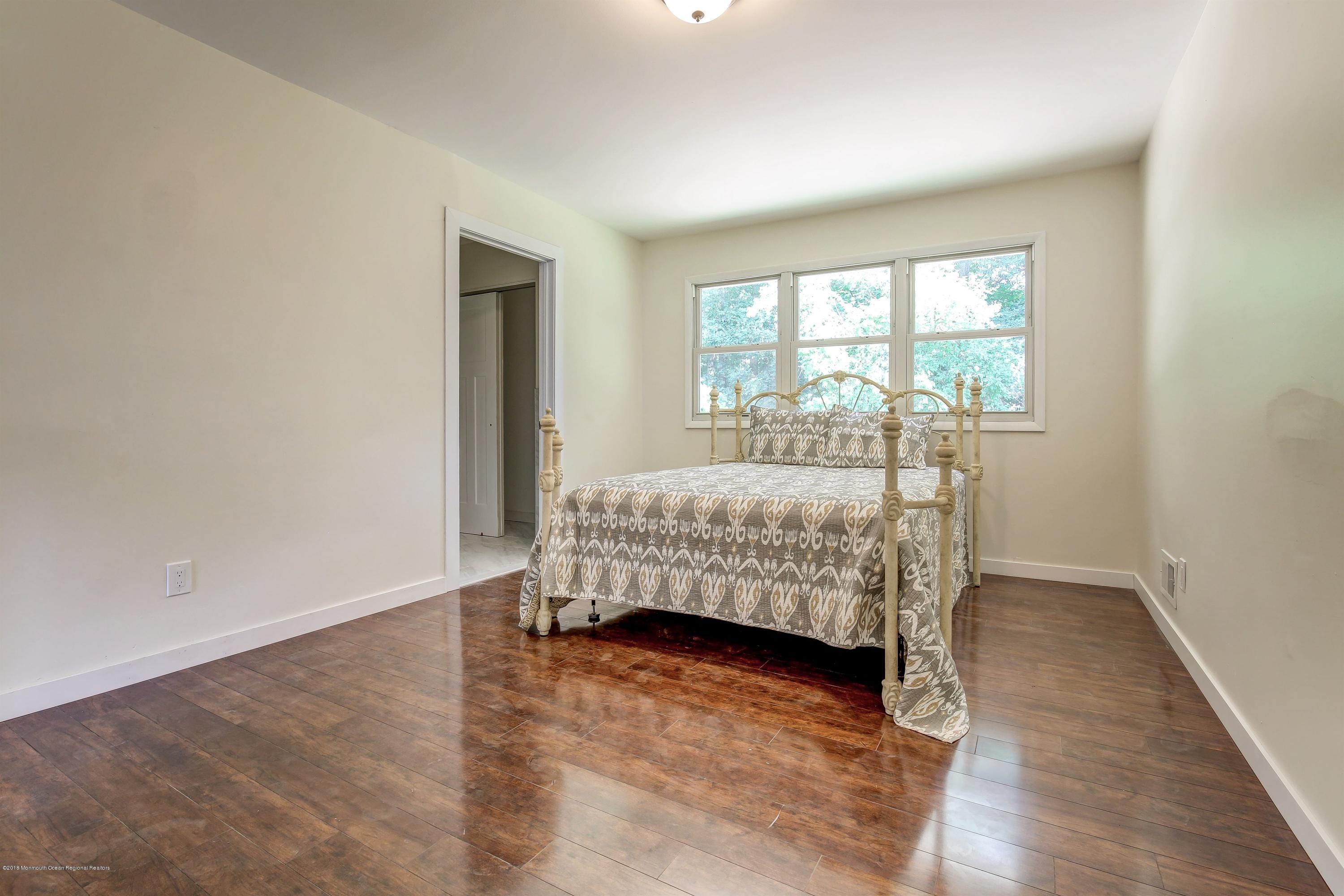 38 Dutch Valley Road Howell, NJ 07731 - Photo 12 of 20 a bedroom with a bed and a window