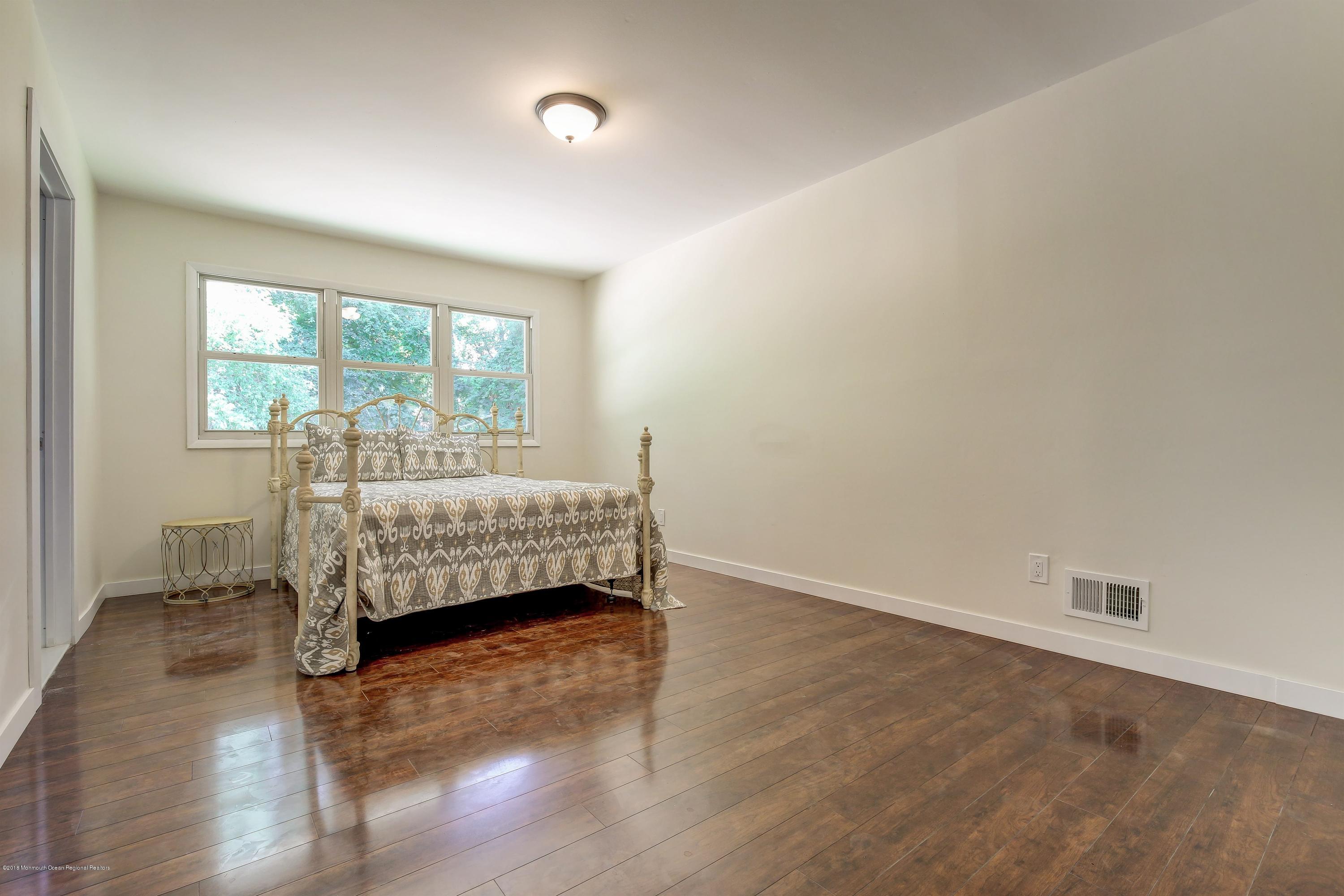 38 Dutch Valley Road Howell, NJ 07731 - Photo 13 of 20 a bedroom with a bed and a window