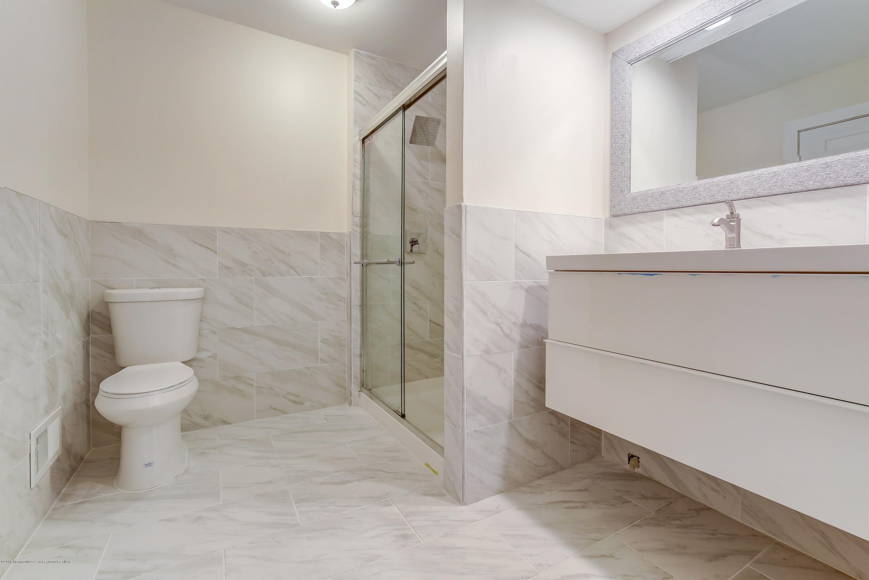 38 Dutch Valley Road Howell, NJ 07731 - Photo 14 of 20 a bathroom with a toilet and a shower
