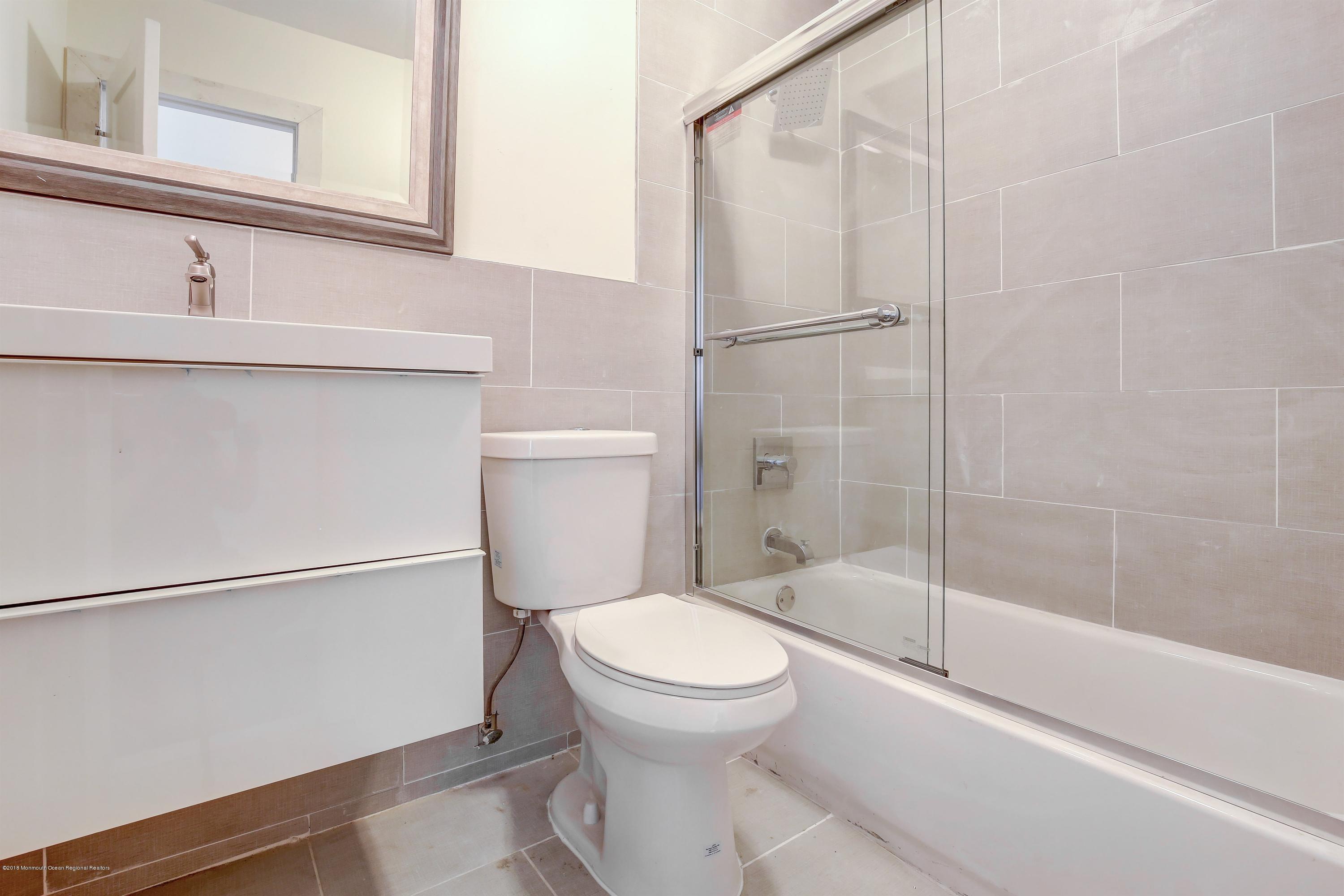 38 Dutch Valley Road Howell, NJ 07731 - Photo 17 of 20 a bathroom with a toilet and a shower