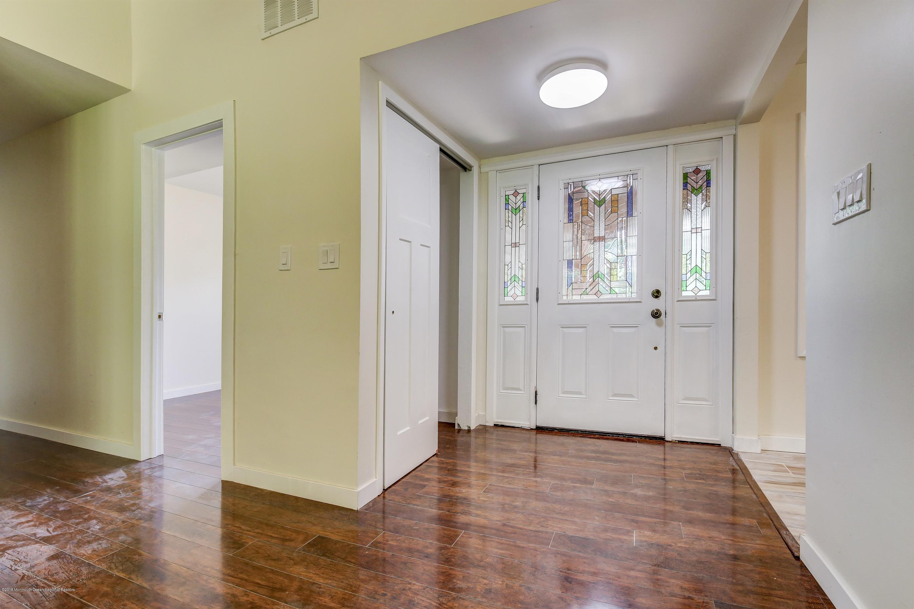 38 Dutch Valley Road Howell, NJ 07731 - Photo 18 of 20 an empty room with wooden floor and windows