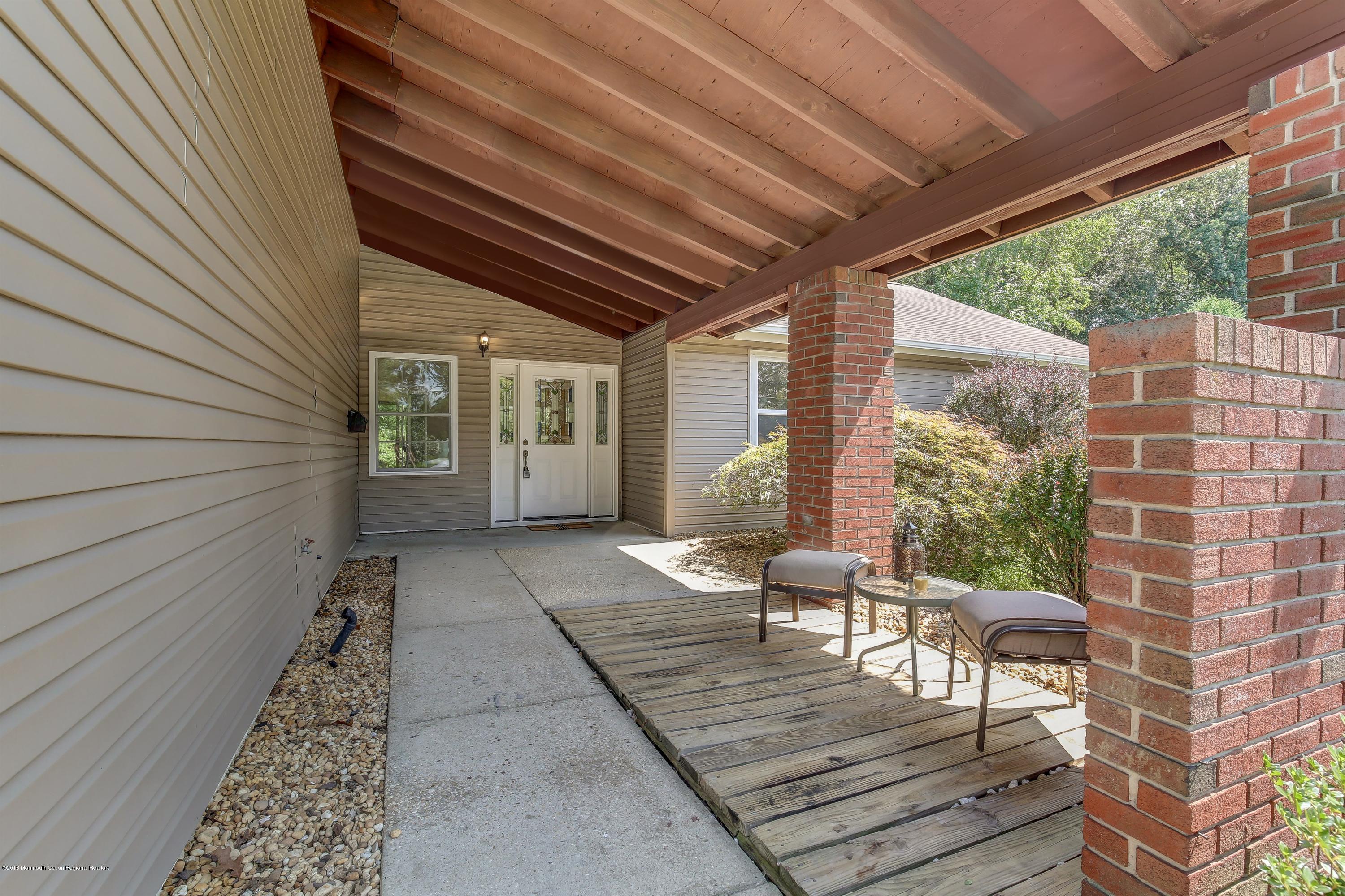 38 Dutch Valley Road Howell, NJ 07731 - Photo 19 of 20 a view of a porch with furniture