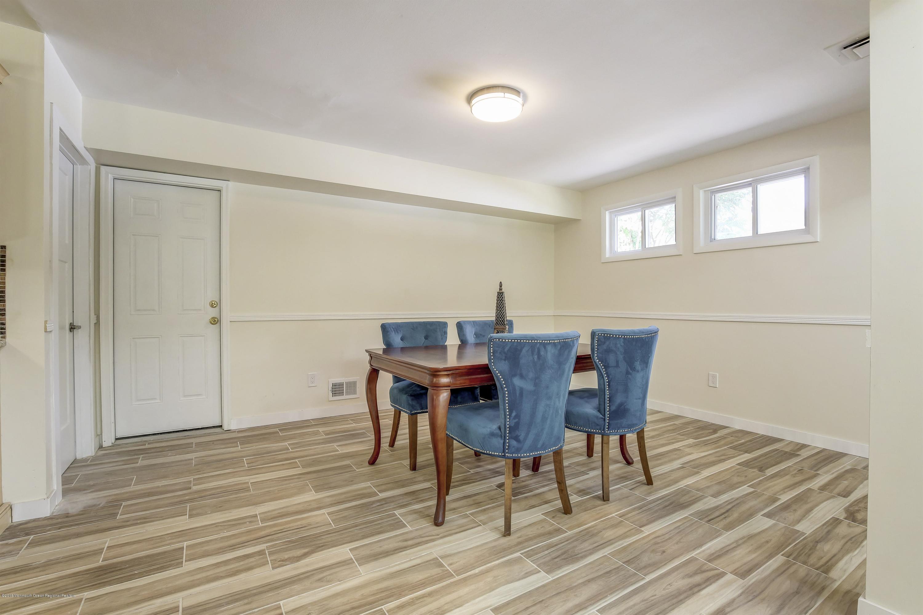 38 Dutch Valley Road Howell, NJ 07731 - Photo 5 of 20 a view of a dining room with furniture and wooden floor