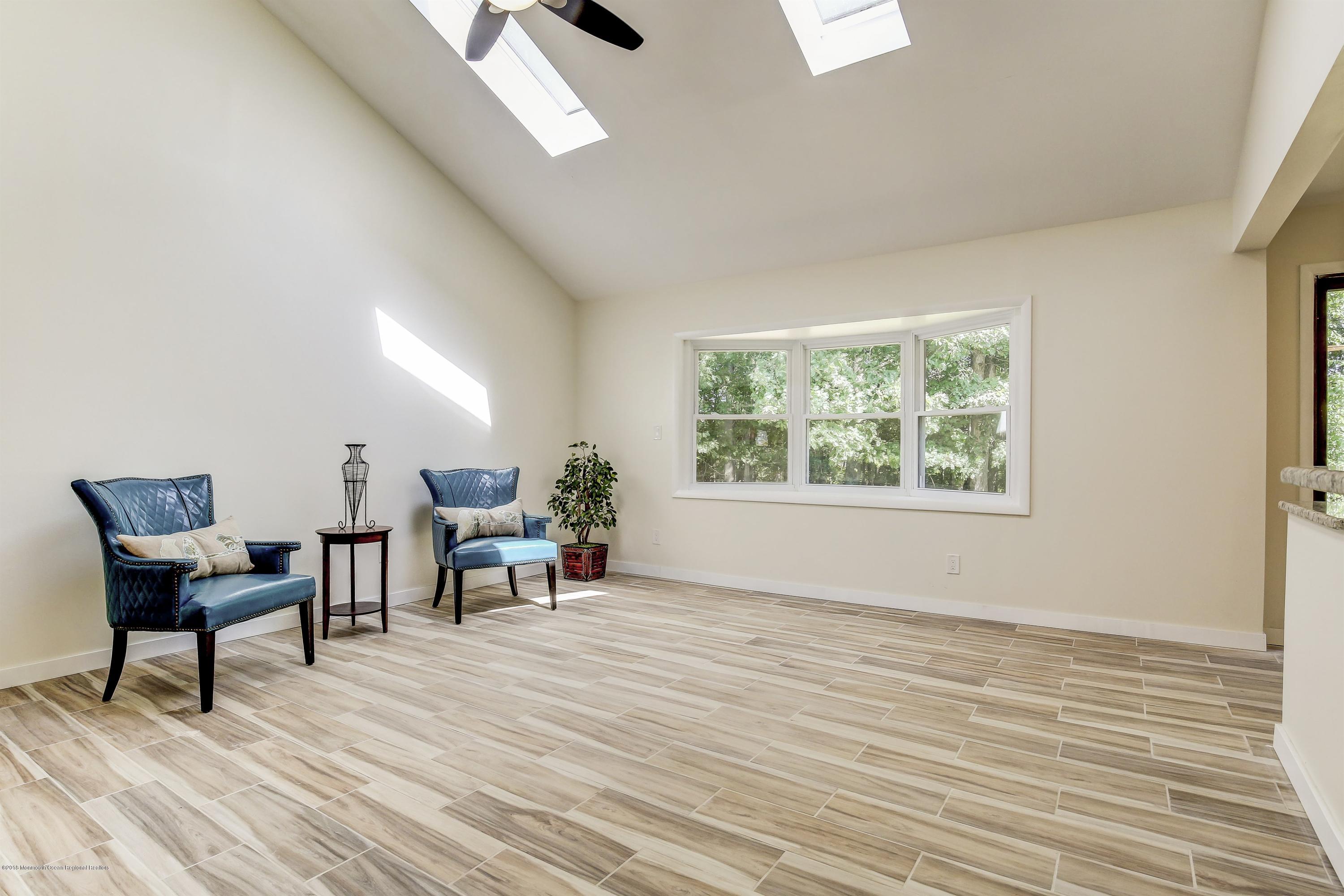 38 Dutch Valley Road Howell, NJ 07731 - Photo 7 of 20 a living room with furniture and a window