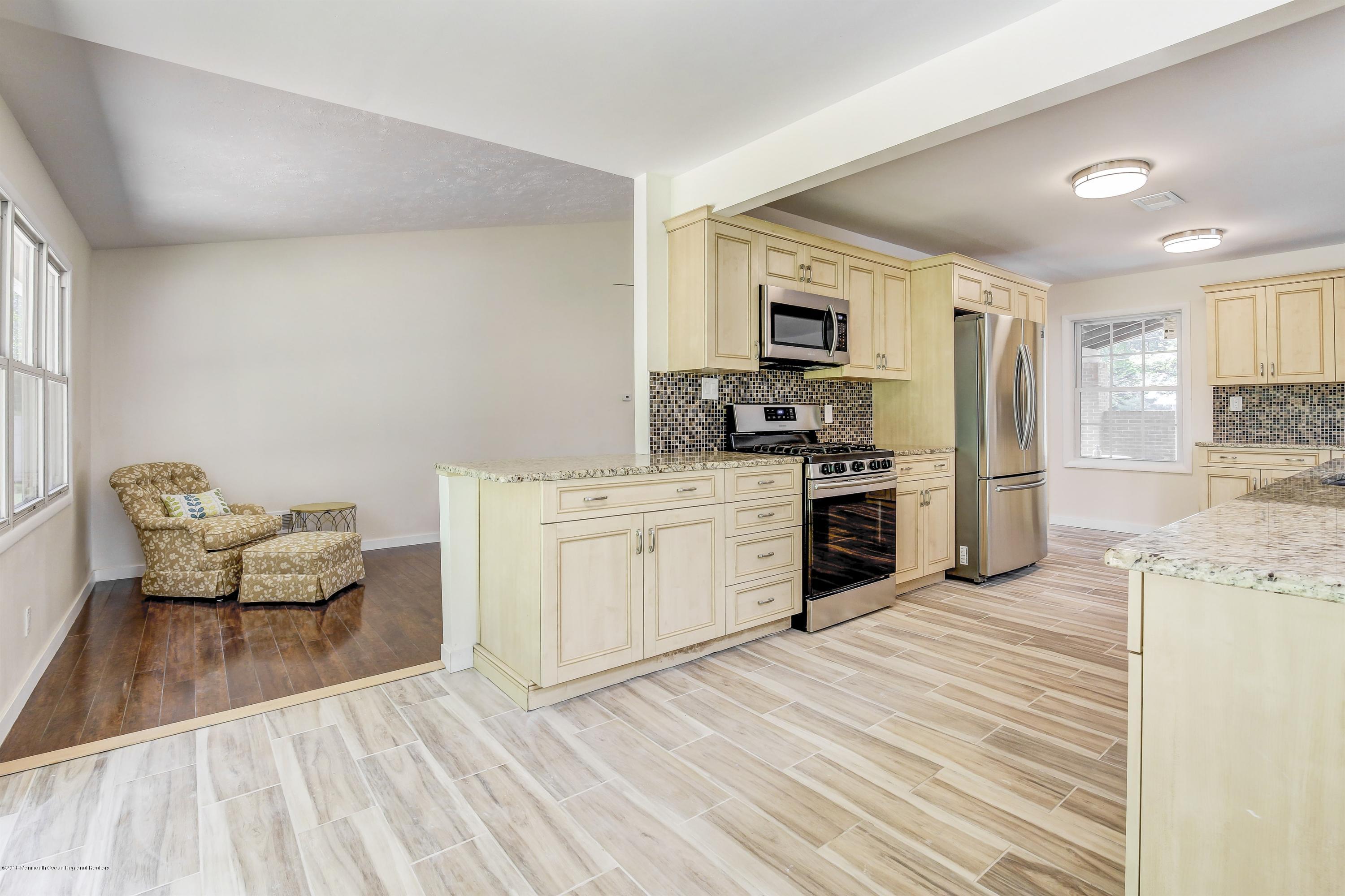 38 Dutch Valley Road Howell, NJ 07731 - Photo 10 of 20 a kitchen with a sink appliances and cabinets