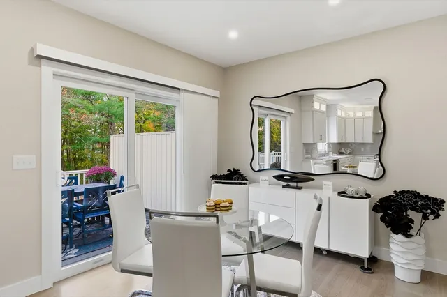 a room with furniture a rug and white walls