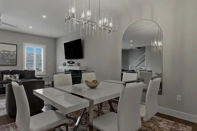 a view of balcony with table and chairs