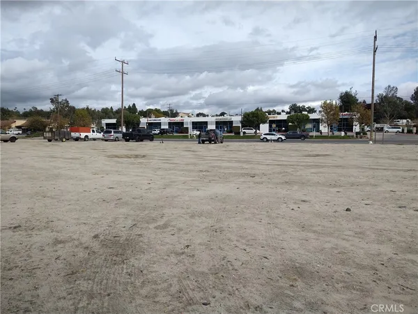 a city street with a building in the background